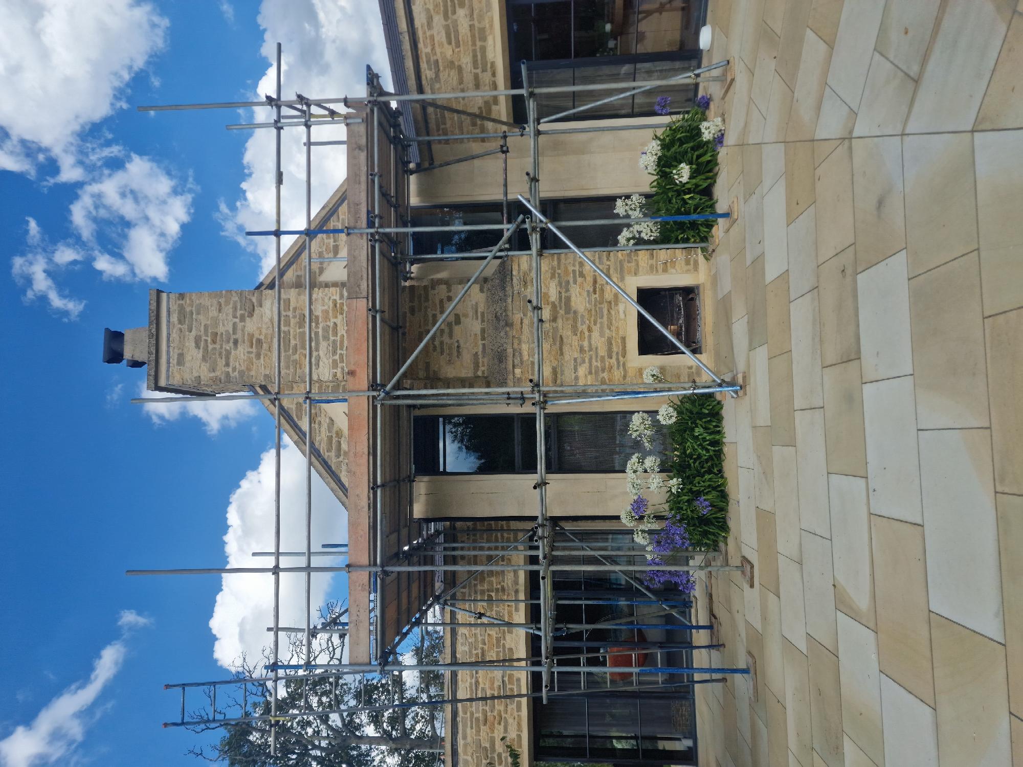 Roof and chimney access scaffold on a stone-built residential property
